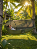 Outdoor hammock with mosquito net in a lush backyard setting