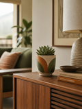 Retro ceramic flower pot on modernized sideboard