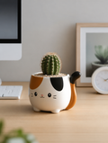 Cartoon Cat Tail Flower Pot on minimalist desk workspace