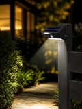 Solar Motion Sensor Garden Light on fence post at night