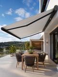 Electric retractable patio awning over luxury outdoor dining area