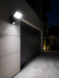 PIR Motion Sensor LED Floodlight on home garage exterior