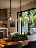 Glass pendant lights above dining table