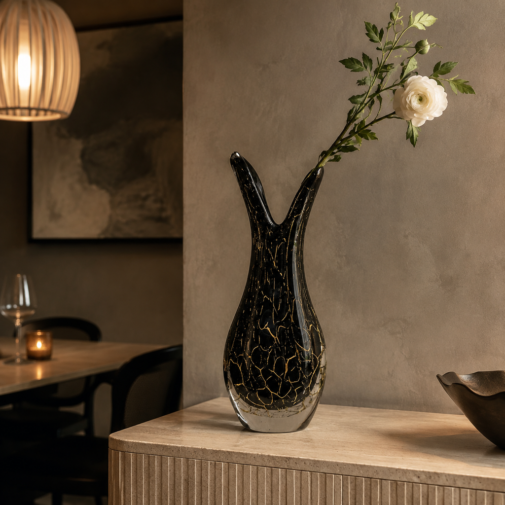 Y-neck black and gold glass vase in a dining room