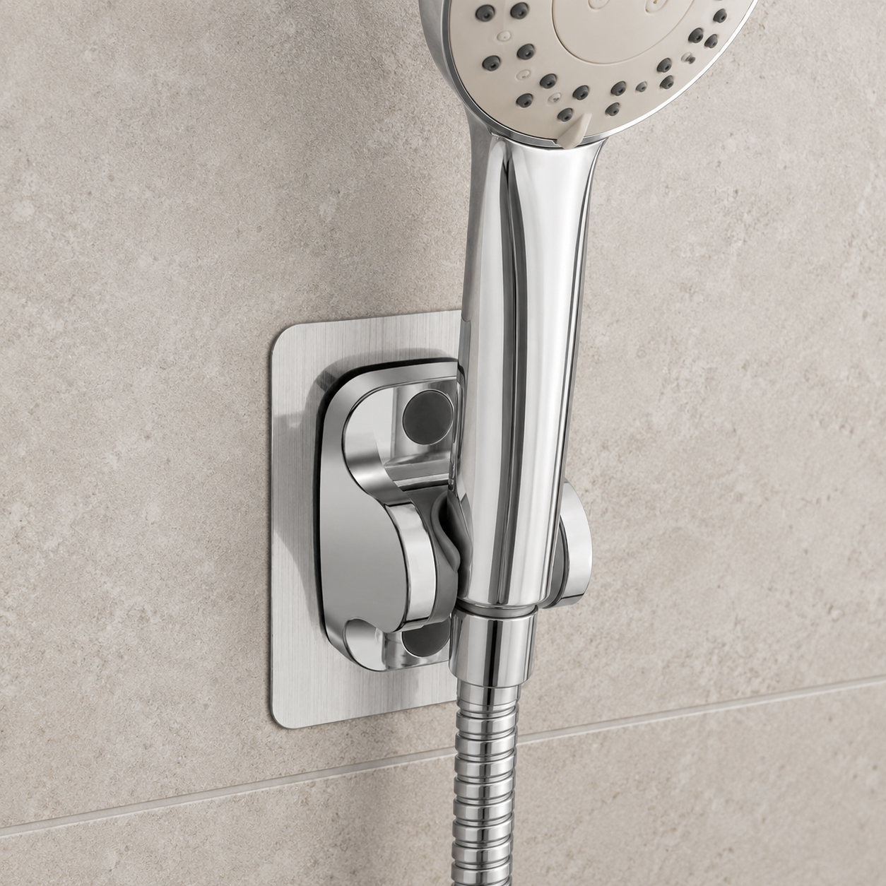 Silver shower holder installed in a modern bathroom